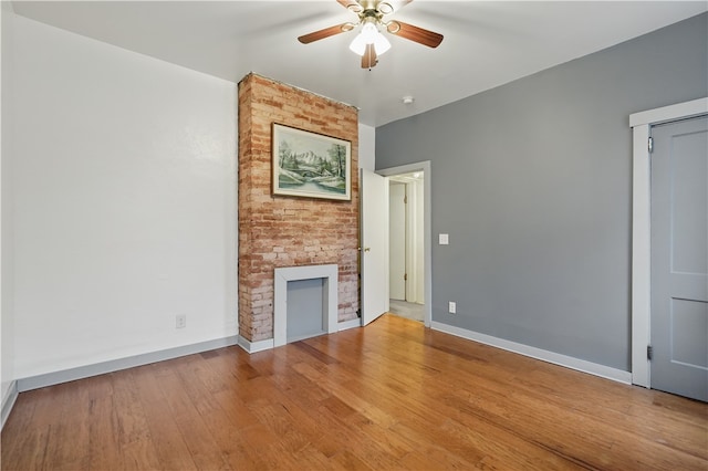 342 E 11th Ave, Homestead, PA 15120 - unfurnished living room featuring a ceiling fan, baseboards, and wood finished floors