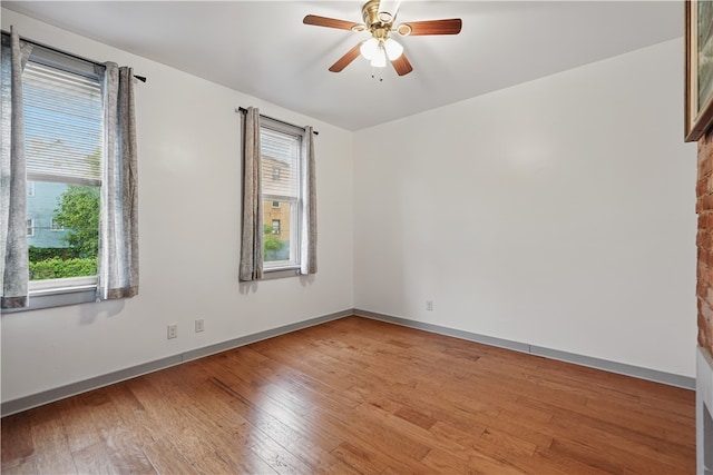 342 E 11th Ave, Homestead, PA 15120 - spare room with hardwood / wood-style flooring, ceiling fan, and baseboards