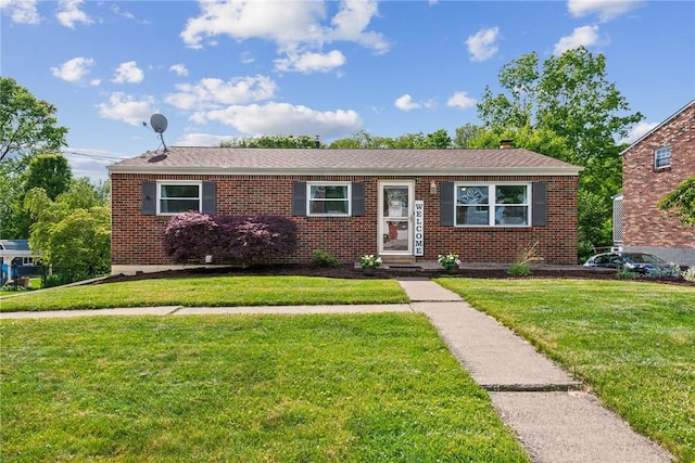 528 Rainier Dr, Plum Boro, PA 15239 - view of front of property with a front yard and brick siding
