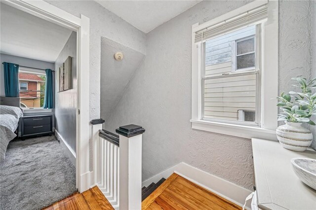510 Central Ave E, Washington Boro, PA 15301 - stairway featuring wood finished floors, a textured wall, and baseboards