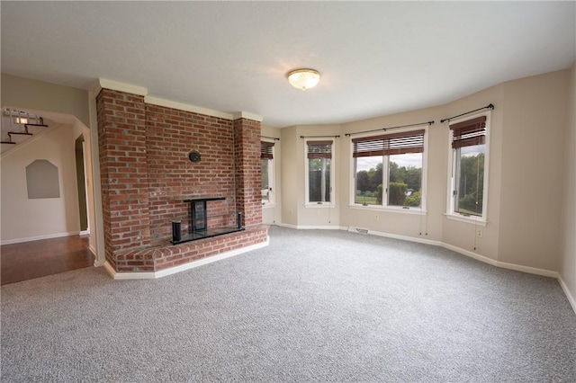302 Shutt Rd, Hempfield Twp Wml, PA 15601 - unfurnished living room with carpet flooring, baseboards, and a fireplace