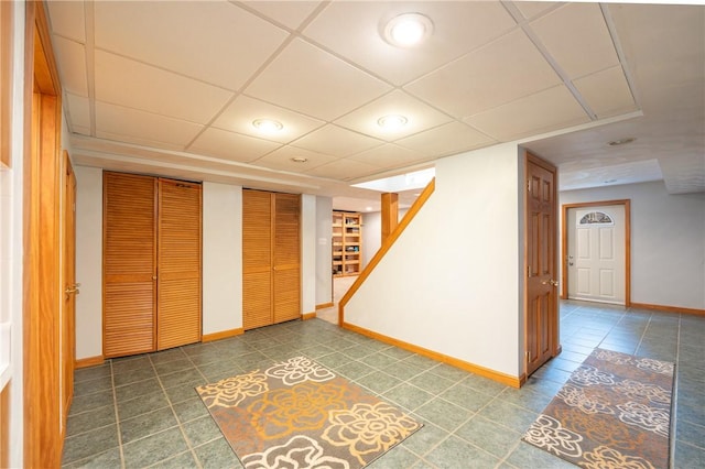 302 Shutt Rd, Hempfield Twp Wml, PA 15601 - finished below grade area with baseboards, stairway, tile patterned flooring, recessed lighting, and a drop ceiling