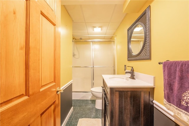 302 Shutt Rd, Hempfield Twp Wml, PA 15601 - bathroom featuring a shower with door, toilet, vanity, tile patterned floors, and a drop ceiling
