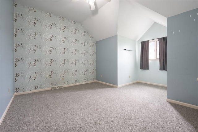 302 Shutt Rd, Hempfield Twp Wml, PA 15601 - bonus room featuring ceiling fan, carpet, baseboards, vaulted ceiling, and wallpapered walls