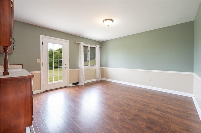 302 Shutt Rd, Hempfield Twp Wml, PA 15601 - unfurnished dining area with dark wood-type flooring and baseboards