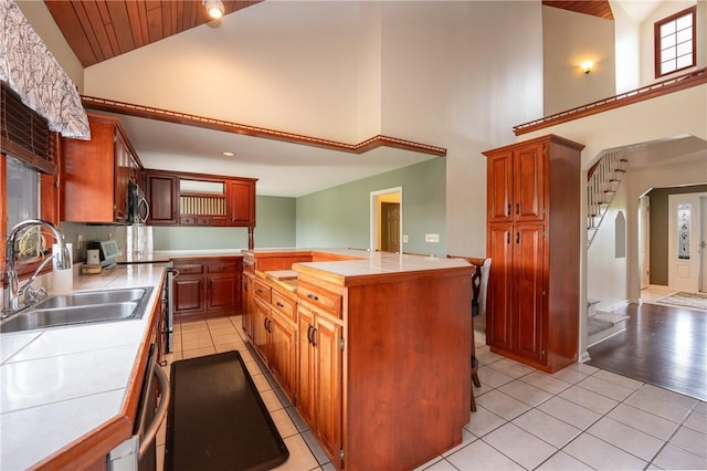 302 Shutt Rd, Hempfield Twp Wml, PA 15601 - kitchen featuring high vaulted ceiling, tile counters, a sink, stainless steel appliances, and wood ceiling