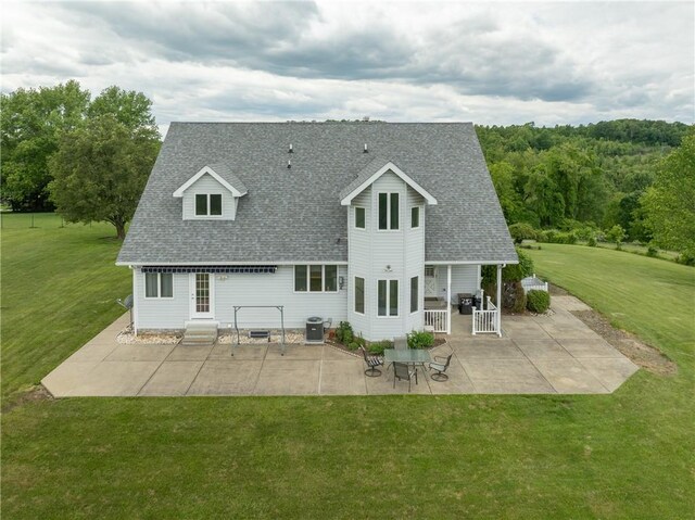 302 Shutt Rd, Hempfield Twp Wml, PA 15601 - rear view of house with a patio area, roof with shingles, a yard, and central AC