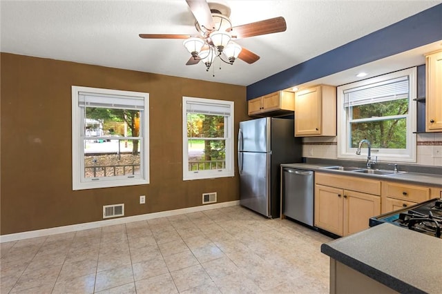 547 Mercer Rd, Twp Of But Ne, PA 16001 - kitchen with stainless steel appliances, a sink, light brown cabinetry, baseboards, and a ceiling fan