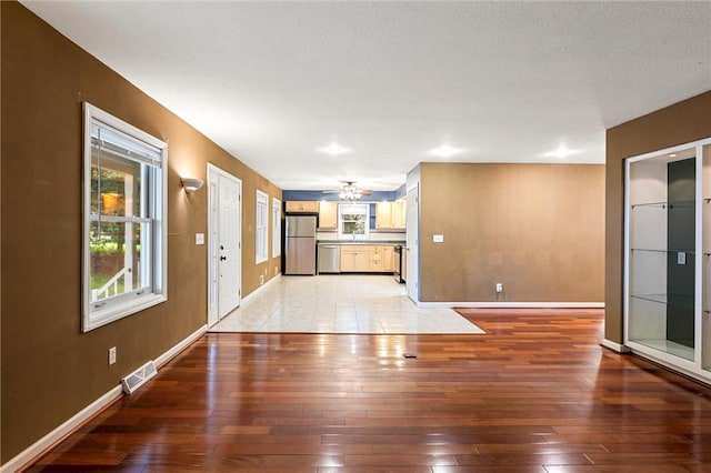 547 Mercer Rd, Twp Of But Ne, PA 16001 - unfurnished living room featuring light wood-style flooring and baseboards