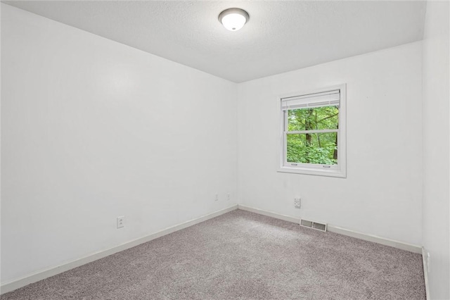 547 Mercer Rd, Twp Of But Ne, PA 16001 - empty room featuring carpet floors, baseboards, and a textured ceiling