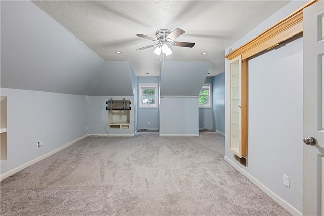547 Mercer Rd, Twp Of But Ne, PA 16001 - unfurnished living room with carpet flooring, a ceiling fan, a textured ceiling, baseboards, and vaulted ceiling