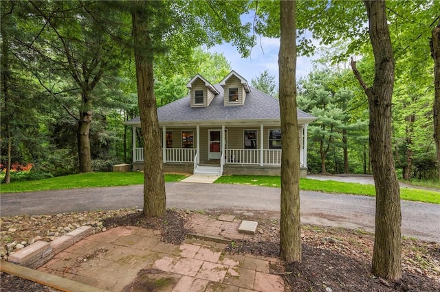 547 Mercer Rd, Twp Of But Ne, PA 16001 - view of front of home featuring a porch, a shingled roof, and asphalt driveway