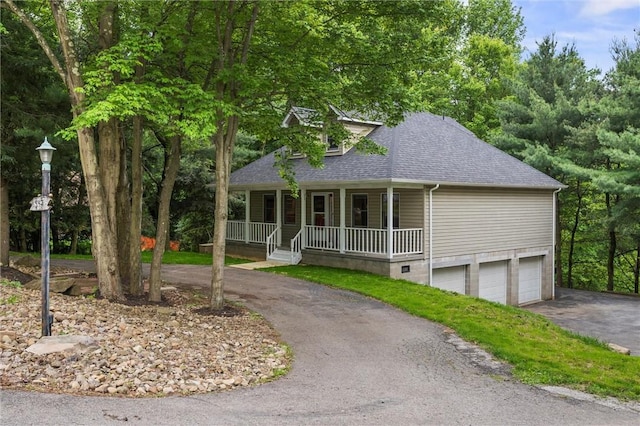 547 Mercer Rd, Twp Of But Ne, PA 16001 - view of front of home with a shingled roof, a porch, driveway, and an attached garage