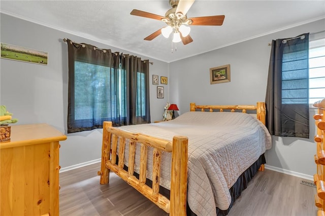 125 Spruce St, Brighton Twp, PA 15009 - bedroom with wood finished floors, ornamental molding, baseboards, and ceiling fan