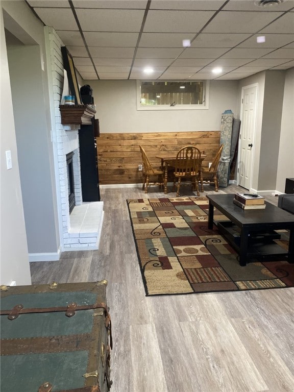 30 Wiggins Ln, South Union Twp, PA 15401 - living area with wood finished floors, a paneled ceiling, and a brick fireplace