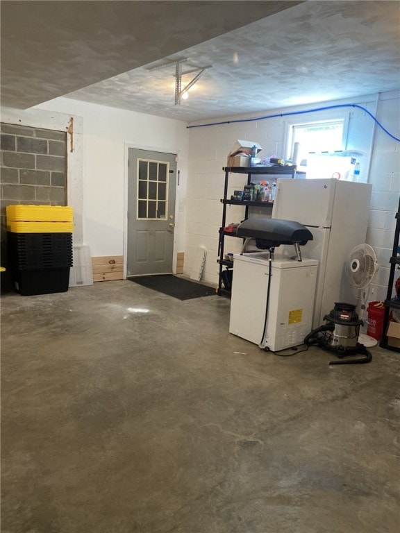 30 Wiggins Ln, South Union Twp, PA 15401 - below grade area featuring concrete block wall, freestanding refrigerator, and refrigerator