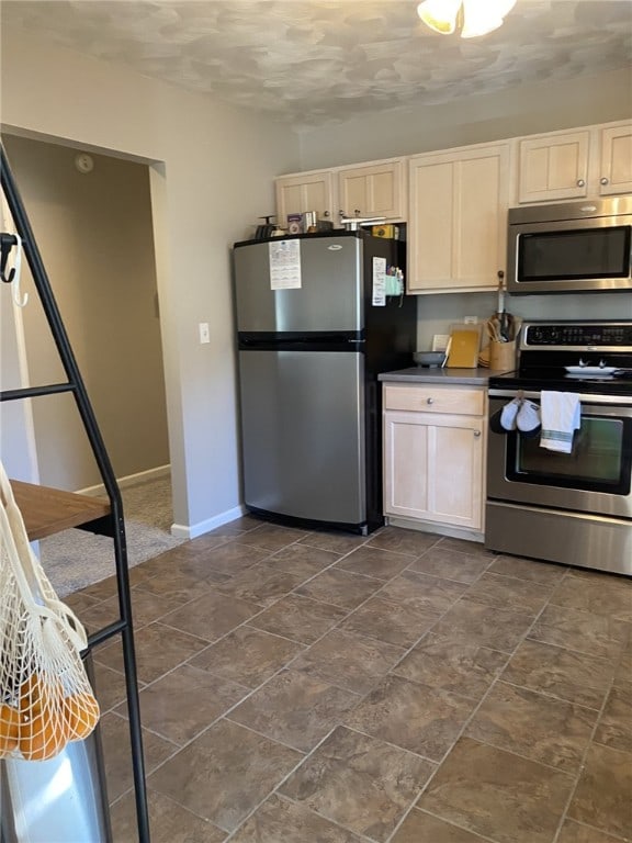 30 Wiggins Ln, South Union Twp, PA 15401 - kitchen with appliances with stainless steel finishes, baseboards, and dark countertops