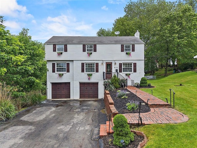 330 Earlwood Rd, Penn Hills, PA 15235 - view of front facade featuring an attached garage, driveway, a front lawn, and a chimney