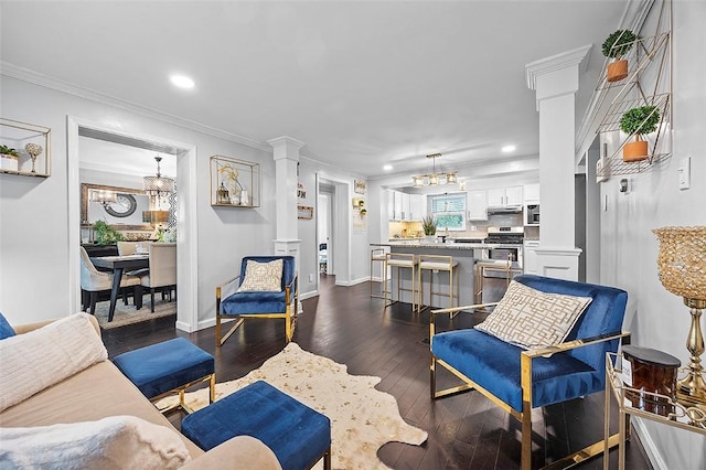 330 Earlwood Rd, Penn Hills, PA 15235 - living area featuring decorative columns, dark wood-type flooring, recessed lighting, crown molding, and baseboards