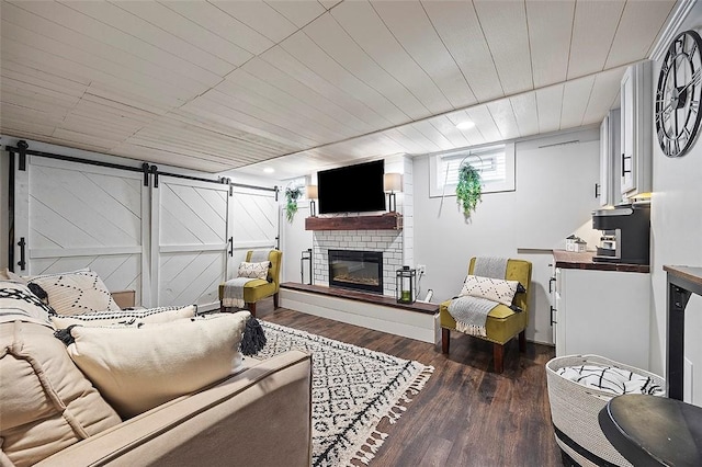 330 Earlwood Rd, Penn Hills, PA 15235 - living area with dark wood-type flooring, a fireplace, a barn door, and recessed lighting