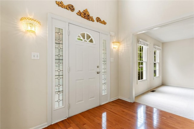 117 Trailside Ct, North Fayette, PA 15108 - foyer featuring wood-type flooring, baseboards, and a chandelier