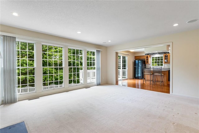 117 Trailside Ct, North Fayette, PA 15108 - unfurnished living room featuring carpet flooring, recessed lighting, baseboards, and a textured ceiling