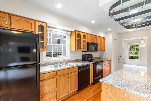 117 Trailside Ct, North Fayette, PA 15108 - kitchen with black appliances, a sink, light wood-style flooring, glass insert cabinets, and recessed lighting