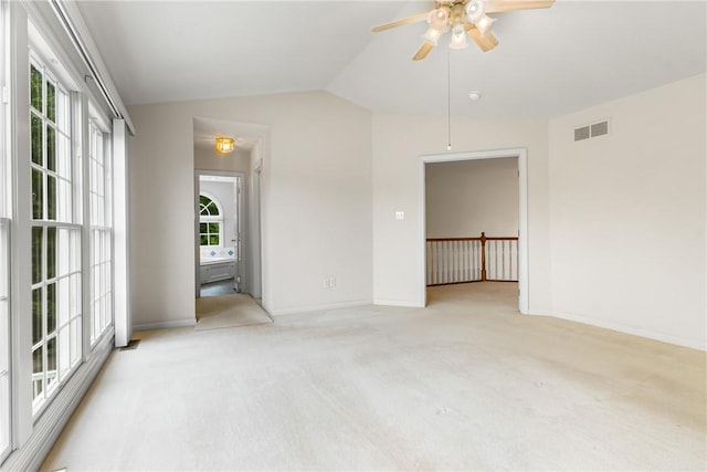 117 Trailside Ct, North Fayette, PA 15108 - empty room featuring lofted ceiling, ceiling fan, light carpet, and baseboards