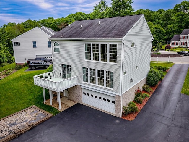 117 Trailside Ct, North Fayette, PA 15108 - rear view of property with a garage, asphalt driveway, a yard, and a shingled roof