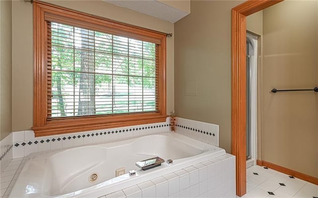 103 Mcdonnell Ln, Middlesex Twp, PA 16002 - full bath with a jetted tub, a stall shower, tile patterned flooring, and baseboards