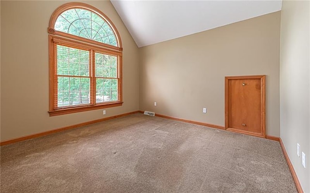 103 Mcdonnell Ln, Middlesex Twp, PA 16002 - spare room with high vaulted ceiling, light carpet, and baseboards