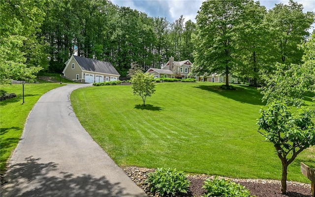 133 Miller Rd, Clinton Twp, PA 16055 - view of front of home featuring a front lawn, an outbuilding, driveway, and view of wooded area
