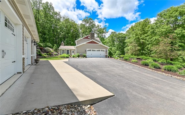 133 Miller Rd, Clinton Twp, PA 16055 - view of front of property featuring a garage and asphalt driveway