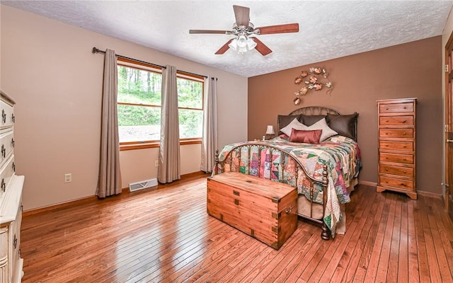 133 Miller Rd, Clinton Twp, PA 16055 - bedroom featuring hardwood / wood-style flooring, a textured ceiling, baseboards, and ceiling fan