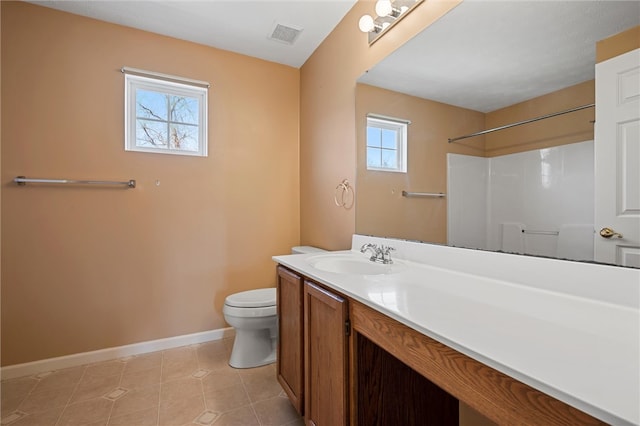 115 Tartan Dr, Hempfield Twp Wml, PA 15601 - full bathroom with baseboards, toilet, vanity, tile patterned flooring, and a shower