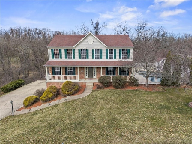 115 Tartan Dr, Hempfield Twp Wml, PA 15601 - colonial-style house with a porch, concrete driveway, and brick siding