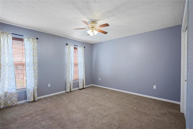 115 Tartan Dr, Hempfield Twp Wml, PA 15601 - empty room featuring a ceiling fan, carpet flooring, baseboards, and a textured ceiling