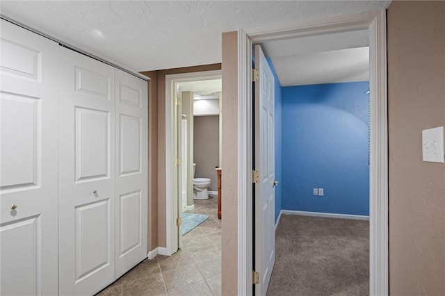 115 Tartan Dr, Hempfield Twp Wml, PA 15601 - hall with baseboards and a textured ceiling