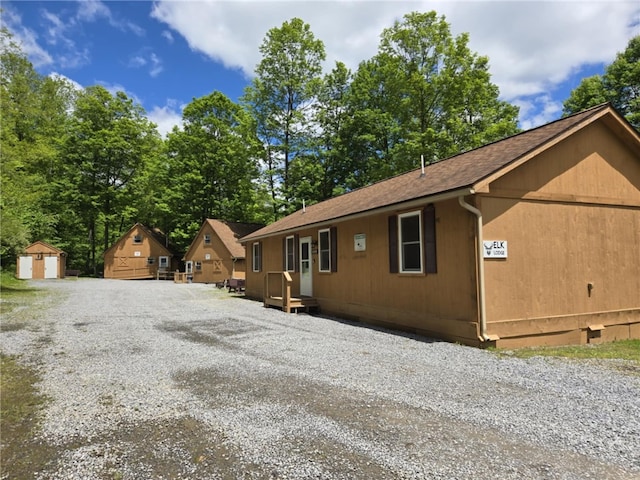 1997 Rock Hill Rd, Benezette, PA 15868 - view of front of property featuring an outdoor structure and a shingled roof