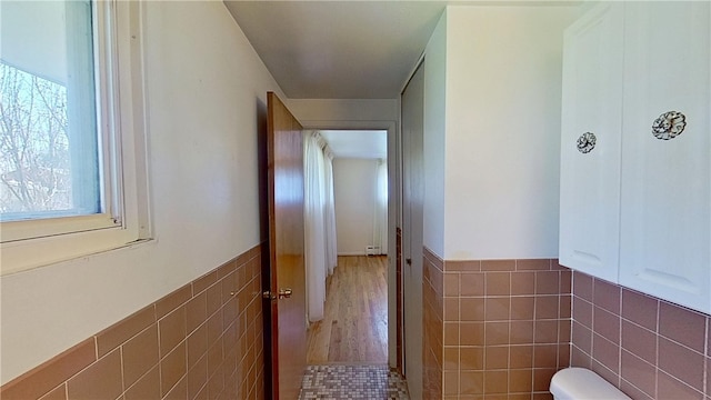 122 Burke Dr, Monroeville, PA 15146 - half bath with tile walls, toilet, and a wainscoted wall