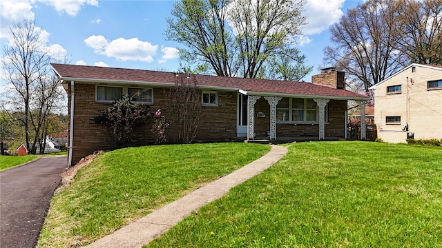 122 Burke Dr, Monroeville, PA 15146 - view of front of home with a front yard, a chimney, and a porch