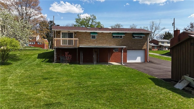 122 Burke Dr, Monroeville, PA 15146 - rear view of house with asphalt driveway, an attached garage, a yard, and brick siding