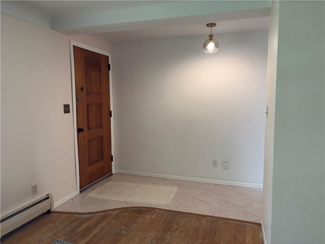 122 Burke Dr, Monroeville, PA 15146 - unfurnished room with a baseboard radiator, light wood-style floors, and baseboards