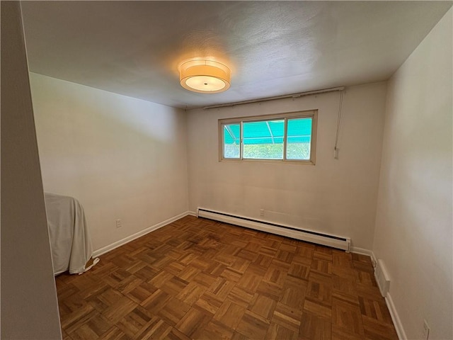 122 Burke Dr, Monroeville, PA 15146 - empty room featuring a baseboard heating unit and baseboards