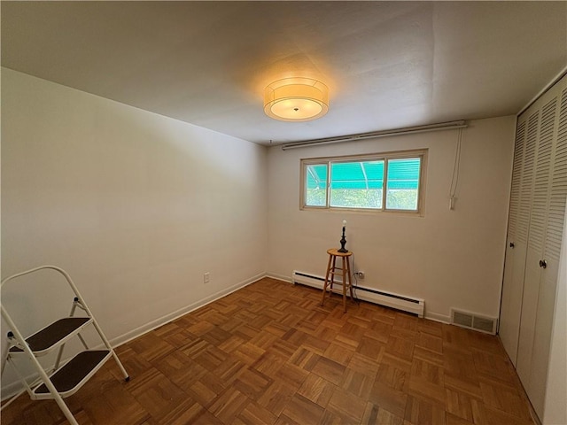 122 Burke Dr, Monroeville, PA 15146 - unfurnished bedroom featuring a closet, a baseboard radiator, and baseboards