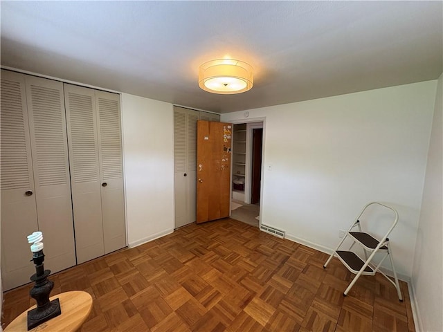 122 Burke Dr, Monroeville, PA 15146 - unfurnished bedroom featuring baseboards and multiple closets