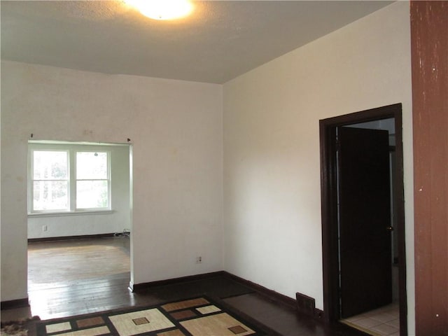 14051407 Brownsville Rd, Carrick, PA 15210 - unfurnished room with wood finished floors and baseboards