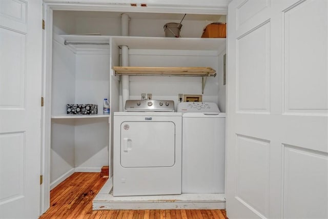 1167 Murray Hill Ave, Squirrel Hill, PA 15217 - laundry room featuring washer and dryer, light wood-type flooring, and baseboards
