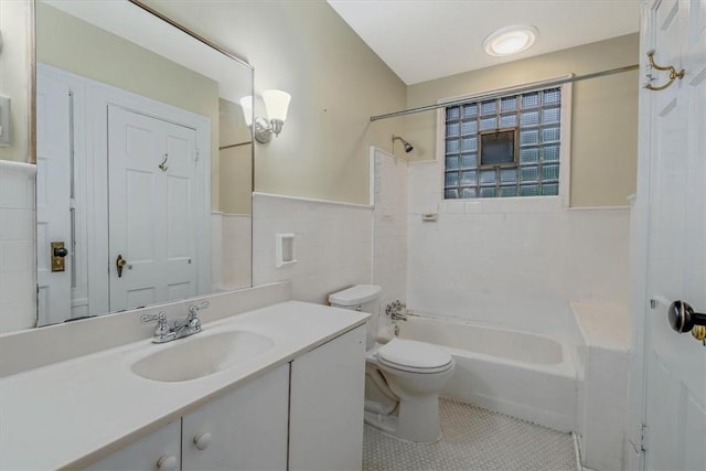 1167 Murray Hill Ave, Squirrel Hill, PA 15217 - bathroom featuring vanity, toilet, tile patterned flooring,  shower combination, and tile walls