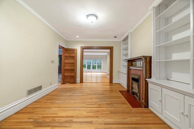 1167 Murray Hill Ave, Squirrel Hill, PA 15217 - unfurnished living room featuring light wood-style flooring, a fireplace with flush hearth, crown molding, baseboards, and built in shelves
